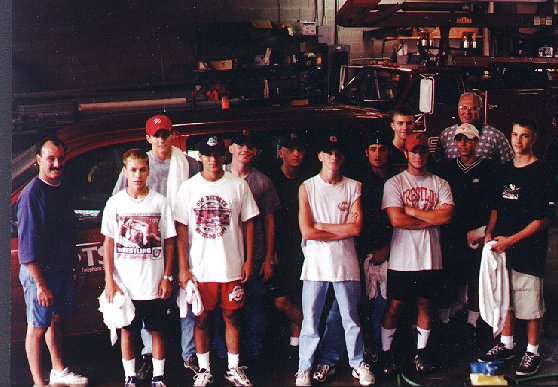 Boys washing trucks at telephone company