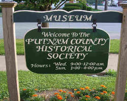 Picture of the Musuem Sign and Office Hours